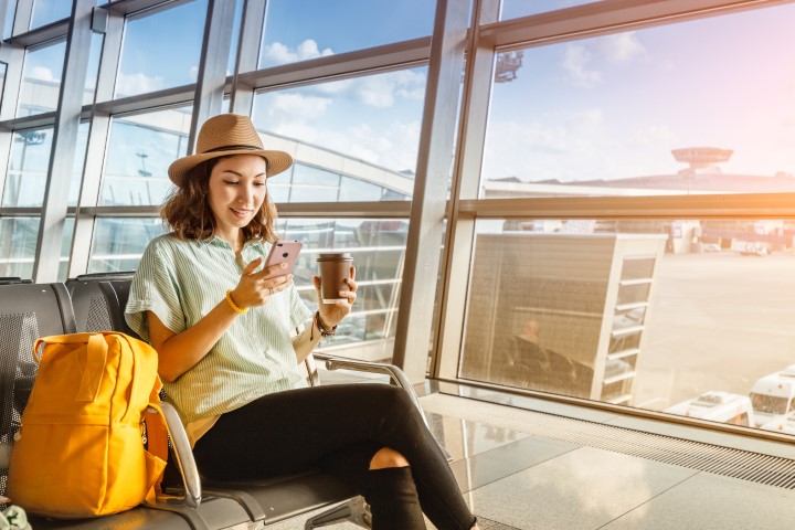 Asian,Girl,Waiting,For,Departure,At,The,Airport,On,Your